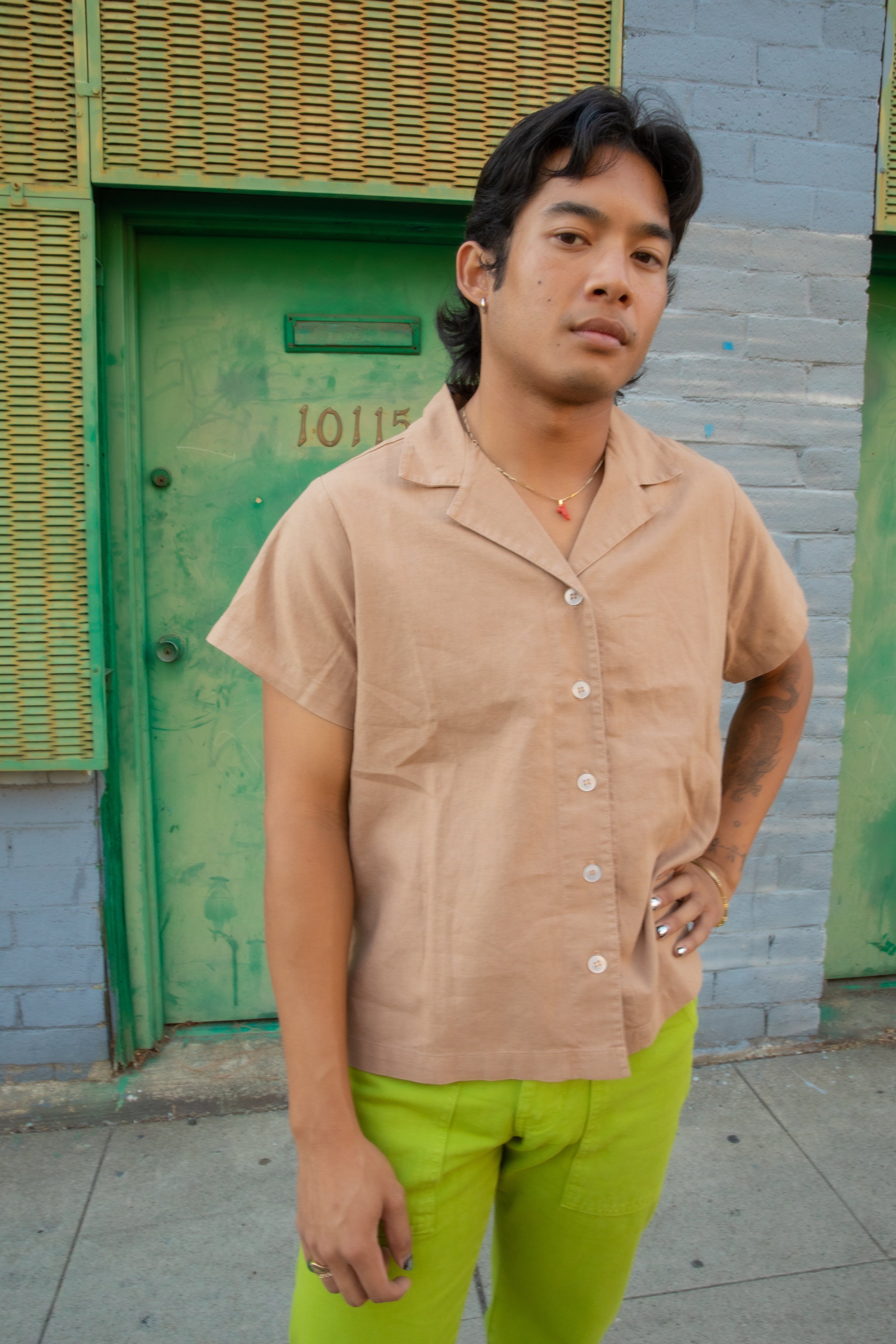 Matt wearing Pantry Button-Up in Tan and Work Pants in Gross Green.