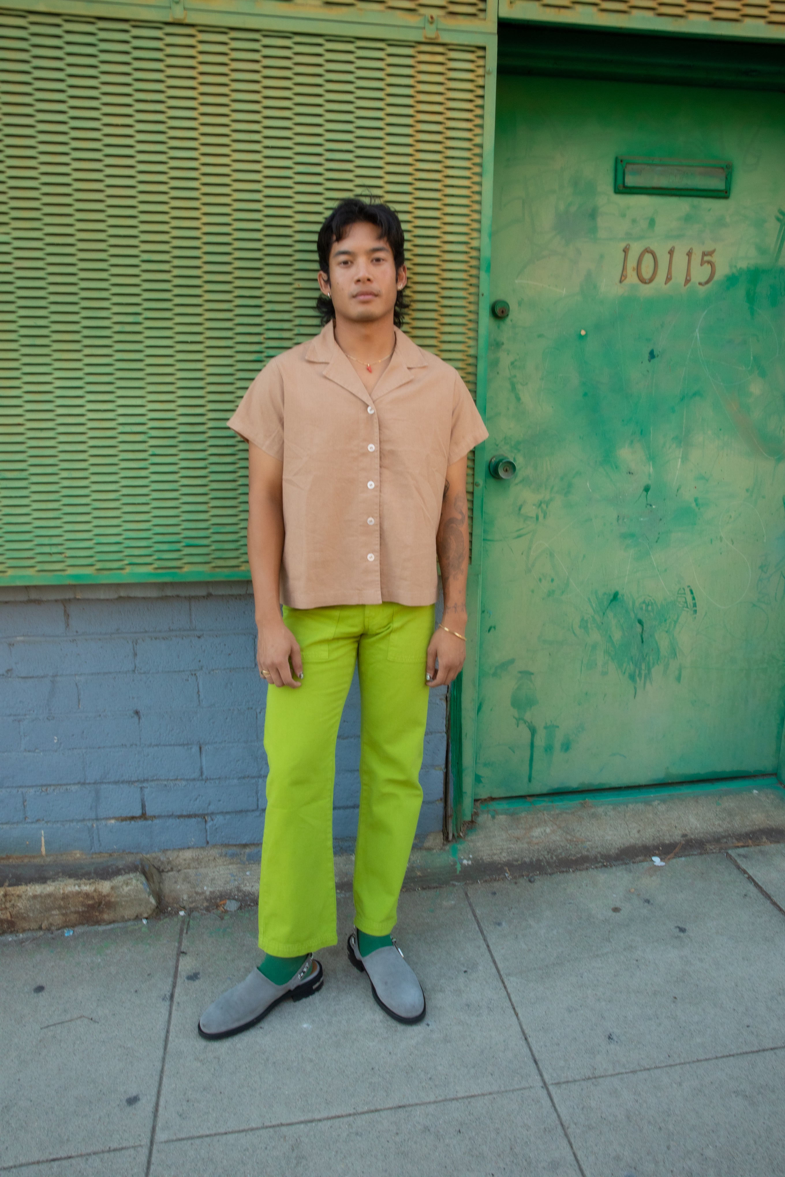 Matt wearing Pantry Button-Up in Tan and Work Pants in Gross Green.