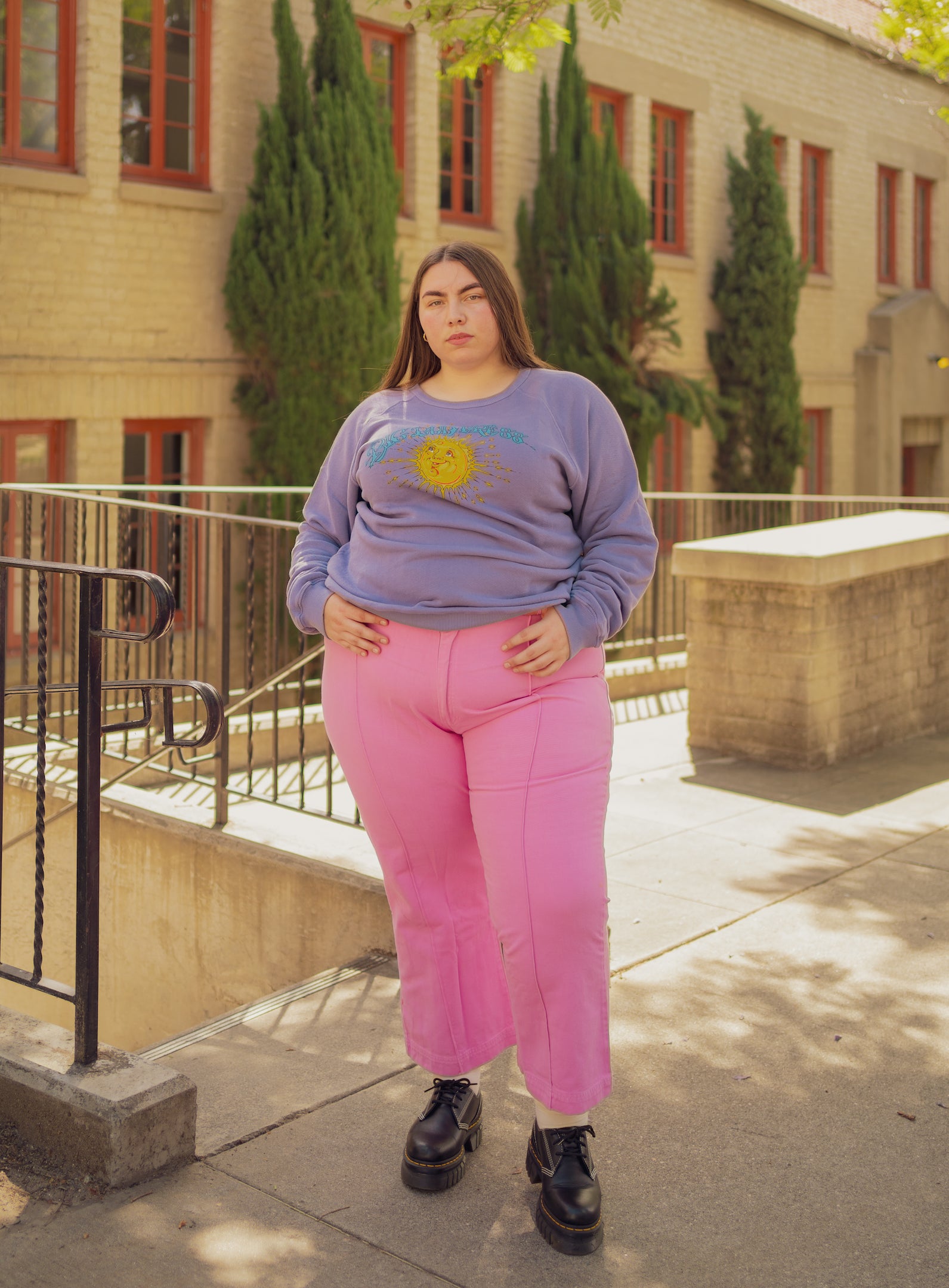 Marielena is wearing Bill Ogden's Sun Baby Crew in Faded Grape and Western Pants in Bubblegum Pink