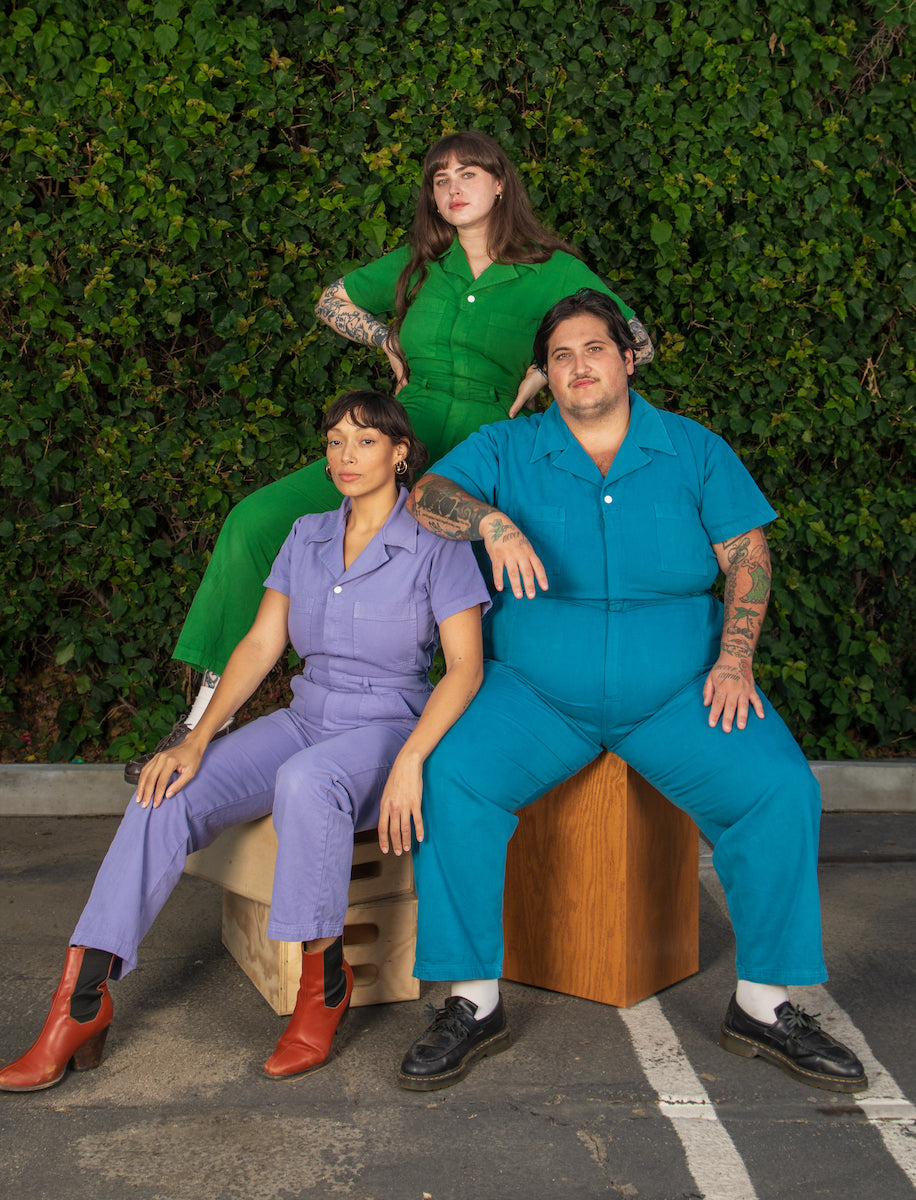 Models Sam (Marine Blue), Sydney (Lawn Green) and Tiara (Faded Grape) are all wearing Short Sleeve Jumpsuits.