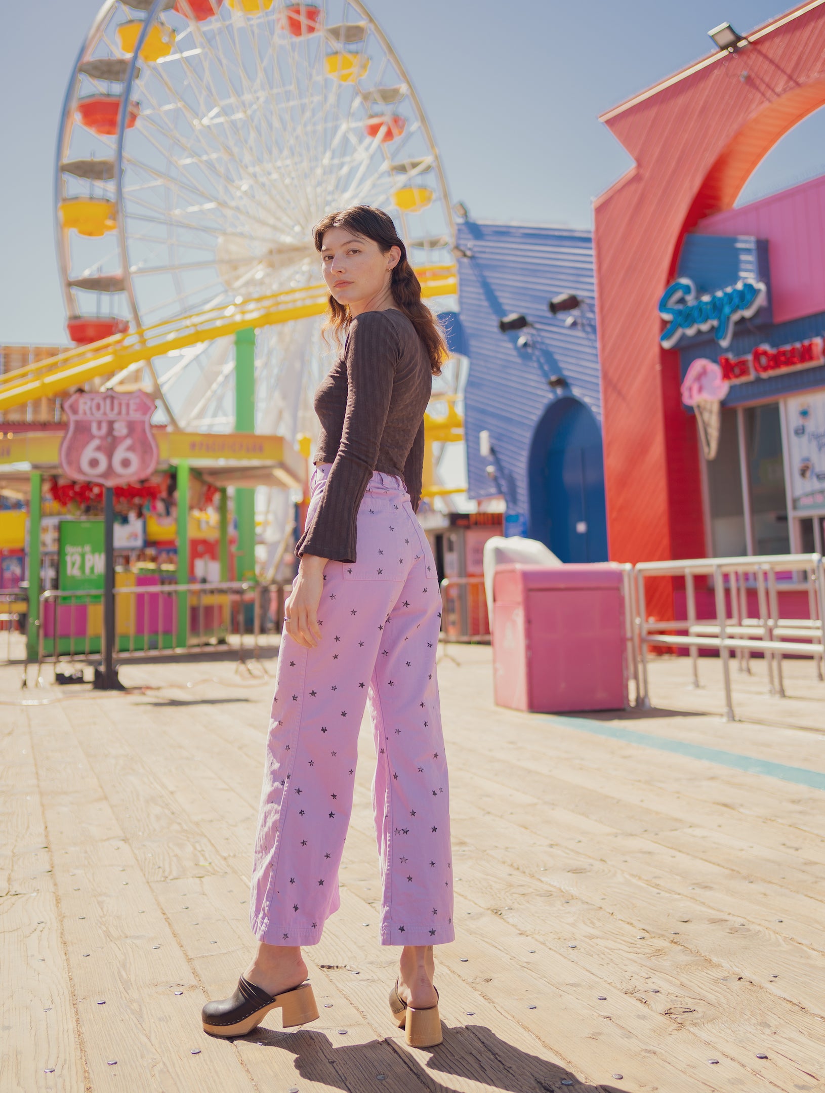 Alexandra Skye is wearing Star Bell Bottoms in Lilac Purple and Bell Sleeve Top in Espresso Brown