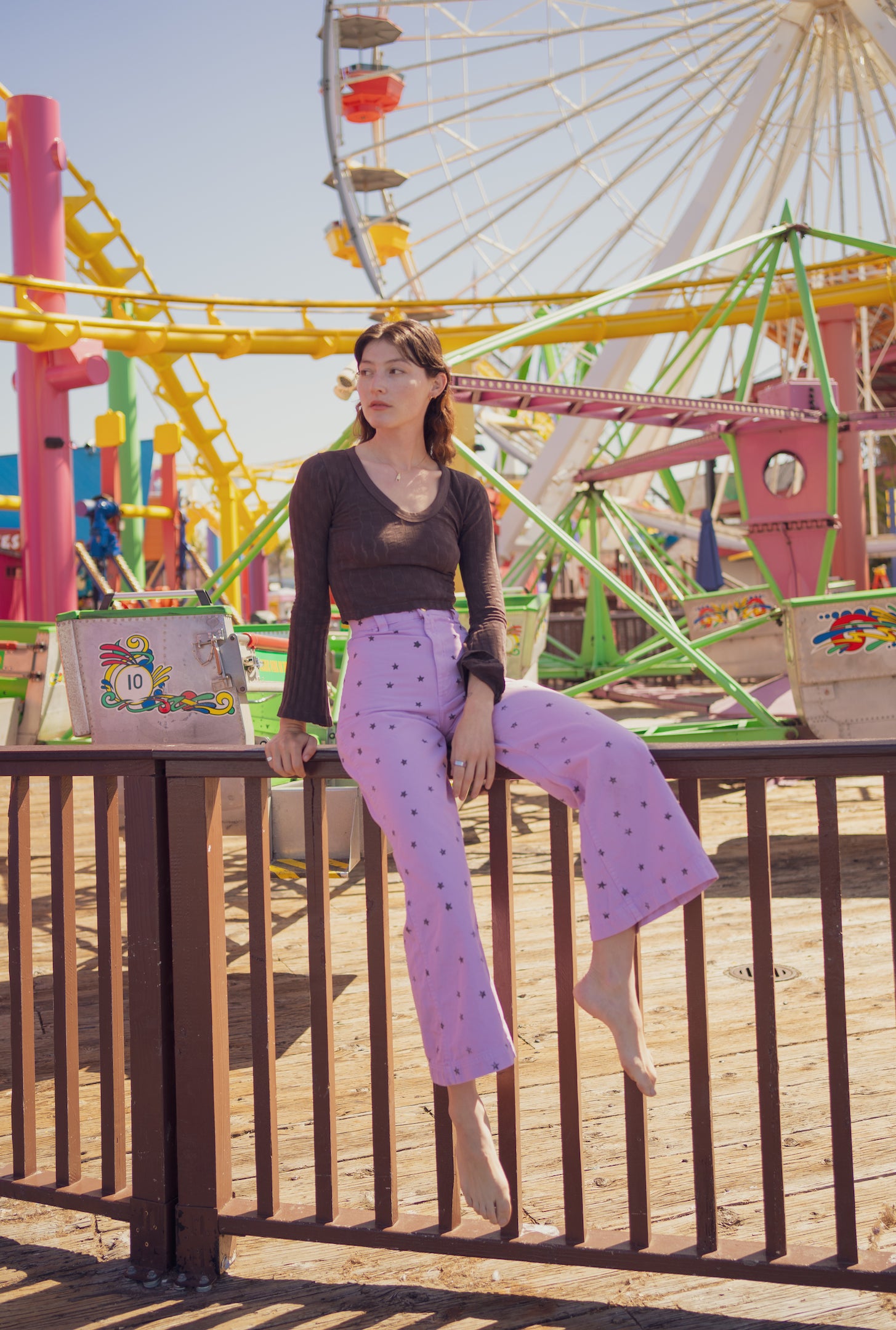 Alexandra Skye is wearing Star Bell Bottoms in Lilac Purple and Bell Sleeve Top in Espresso Brown