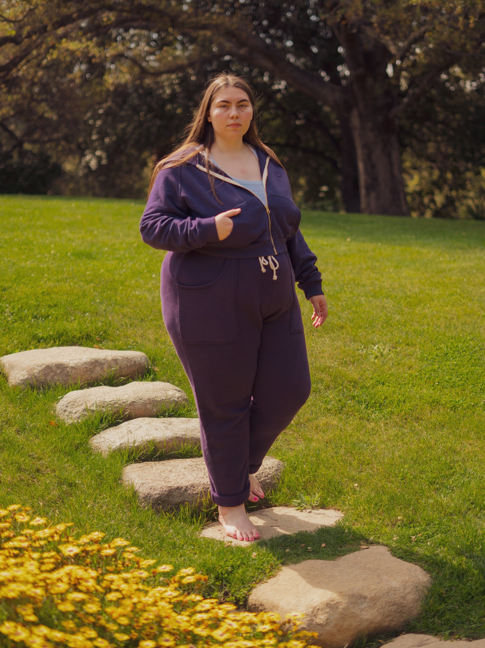 Marielena is wearing Cropped Zip Hoodie in Nebula Purple and matching Rolled Cuff Sweat Pants