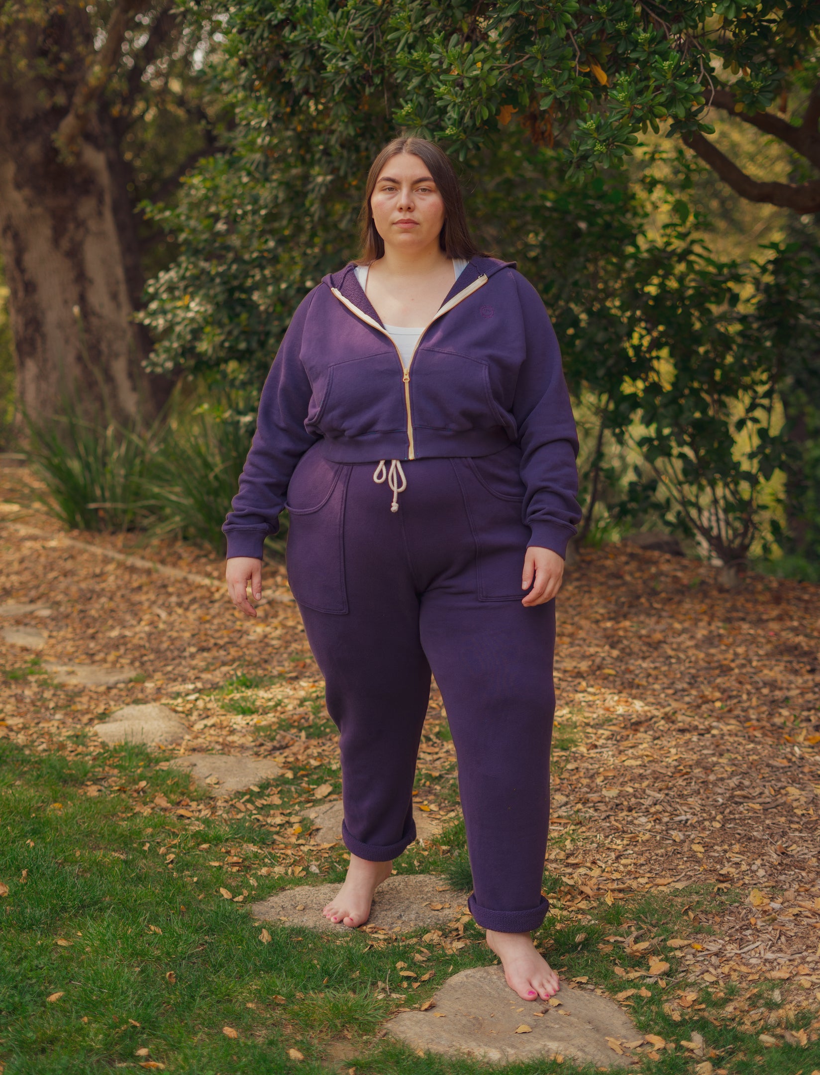 Marielena is wearing Cropped Zip Hoodie in Nebula Purple and matching Rolled Cuff Sweat Pants