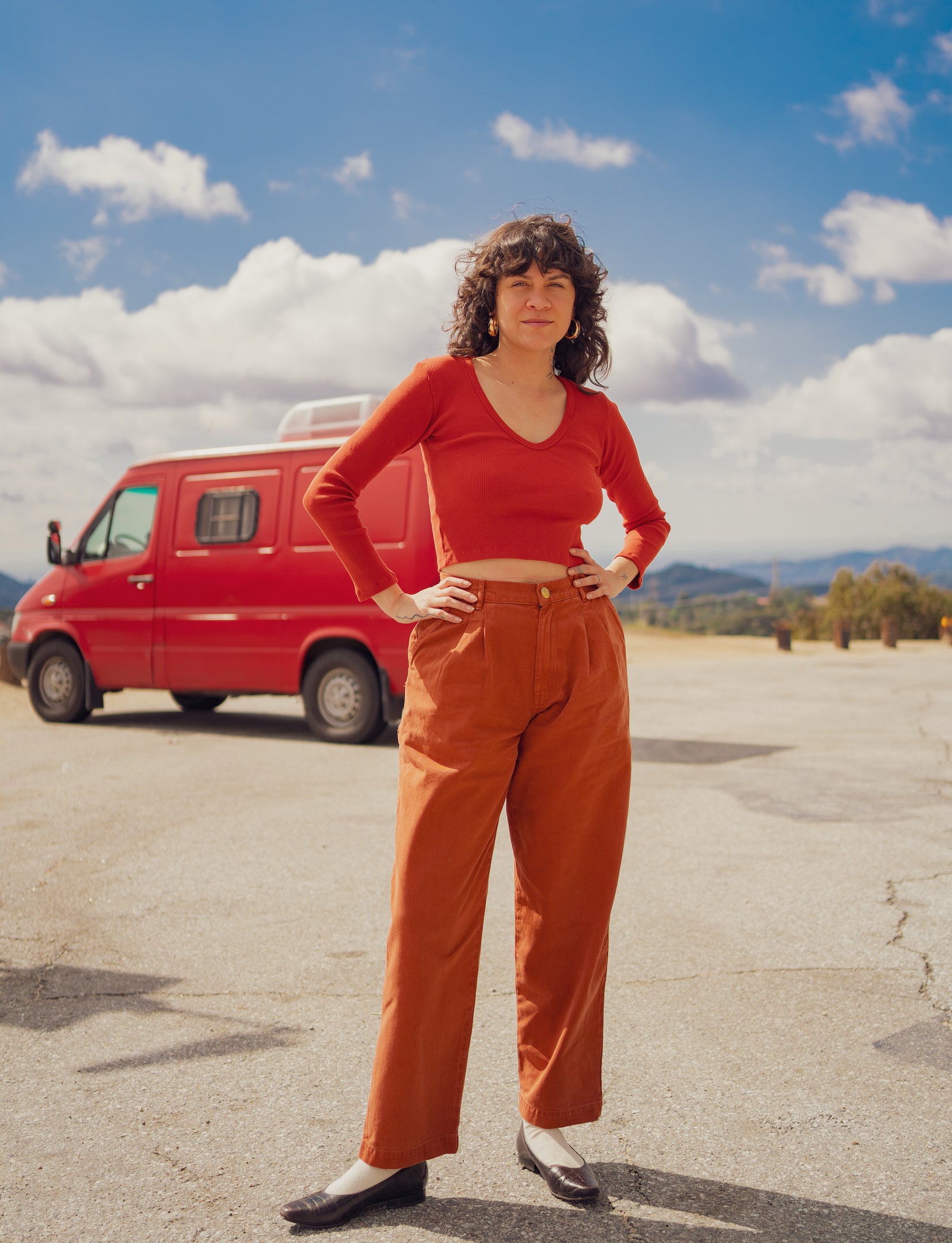 Julia is wearing Long Sleeve V-Neck in Paprika and Heavyweight Trousers in Burnt Terracotta