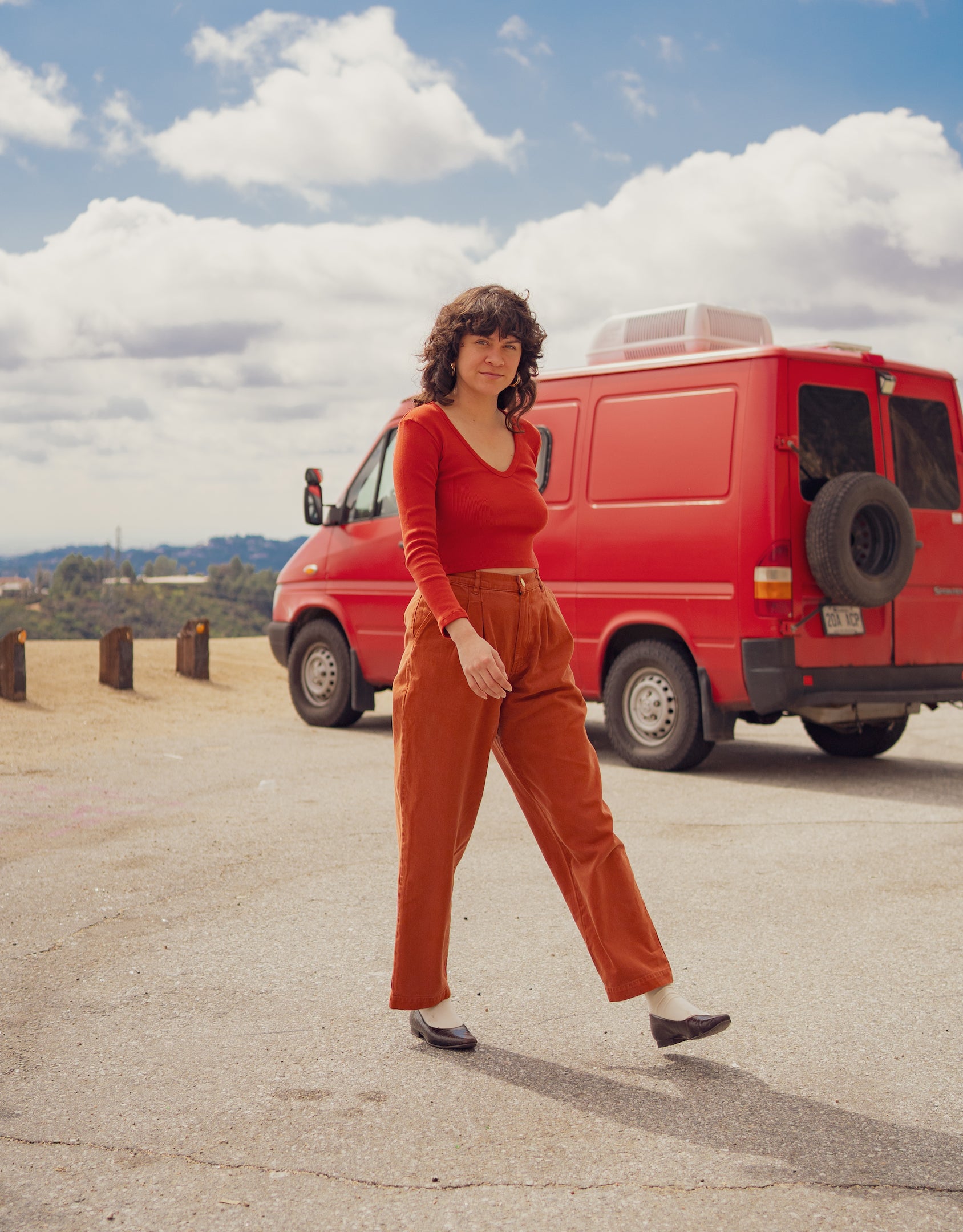 Julia is wearing Long Sleeve V-Neck in Paprika and Heavyweight Trousers in Burnt Terracotta