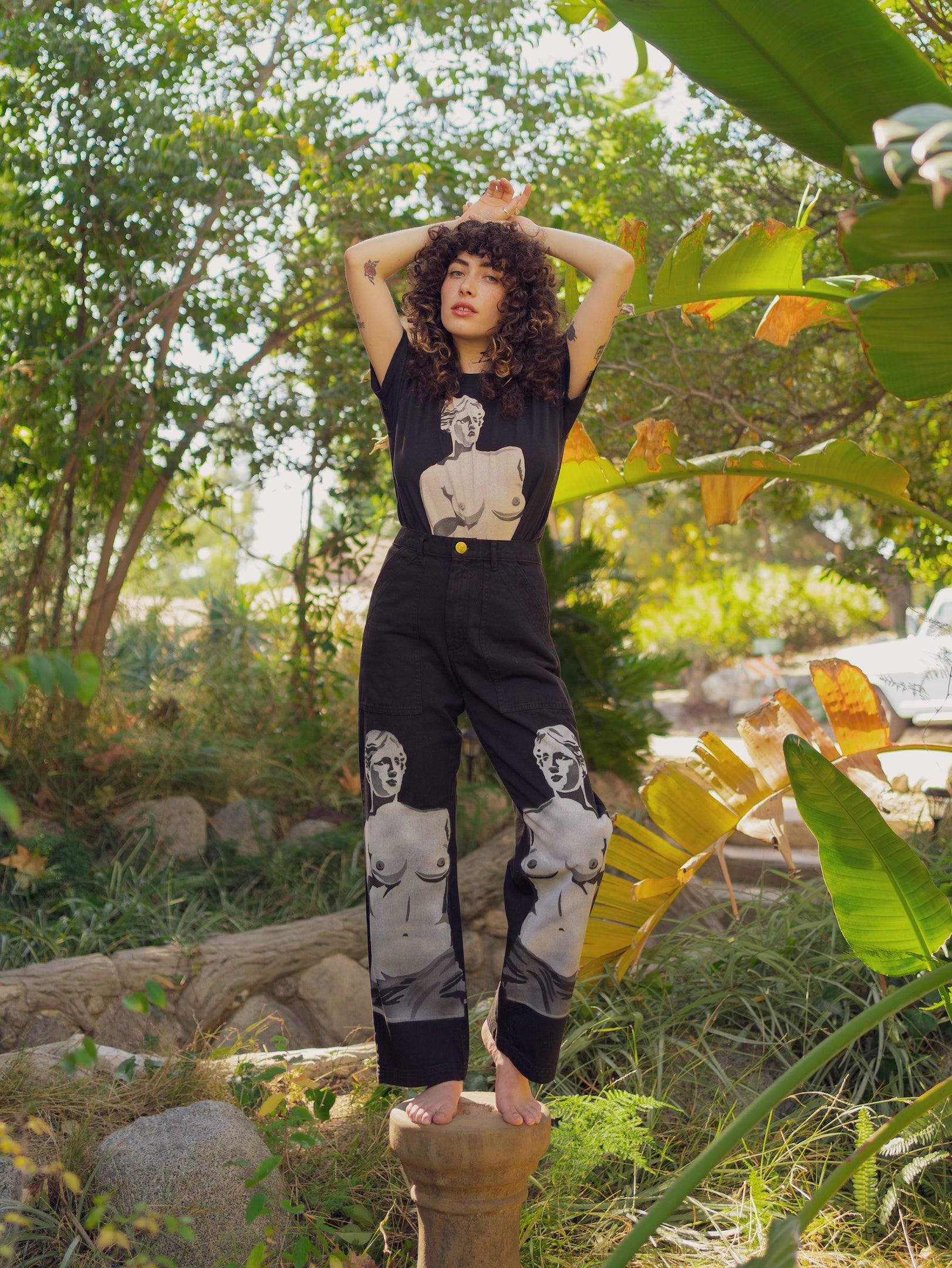 Rene Ferry is wearing Black Venus Organic Tee and Black Venus Work Pants