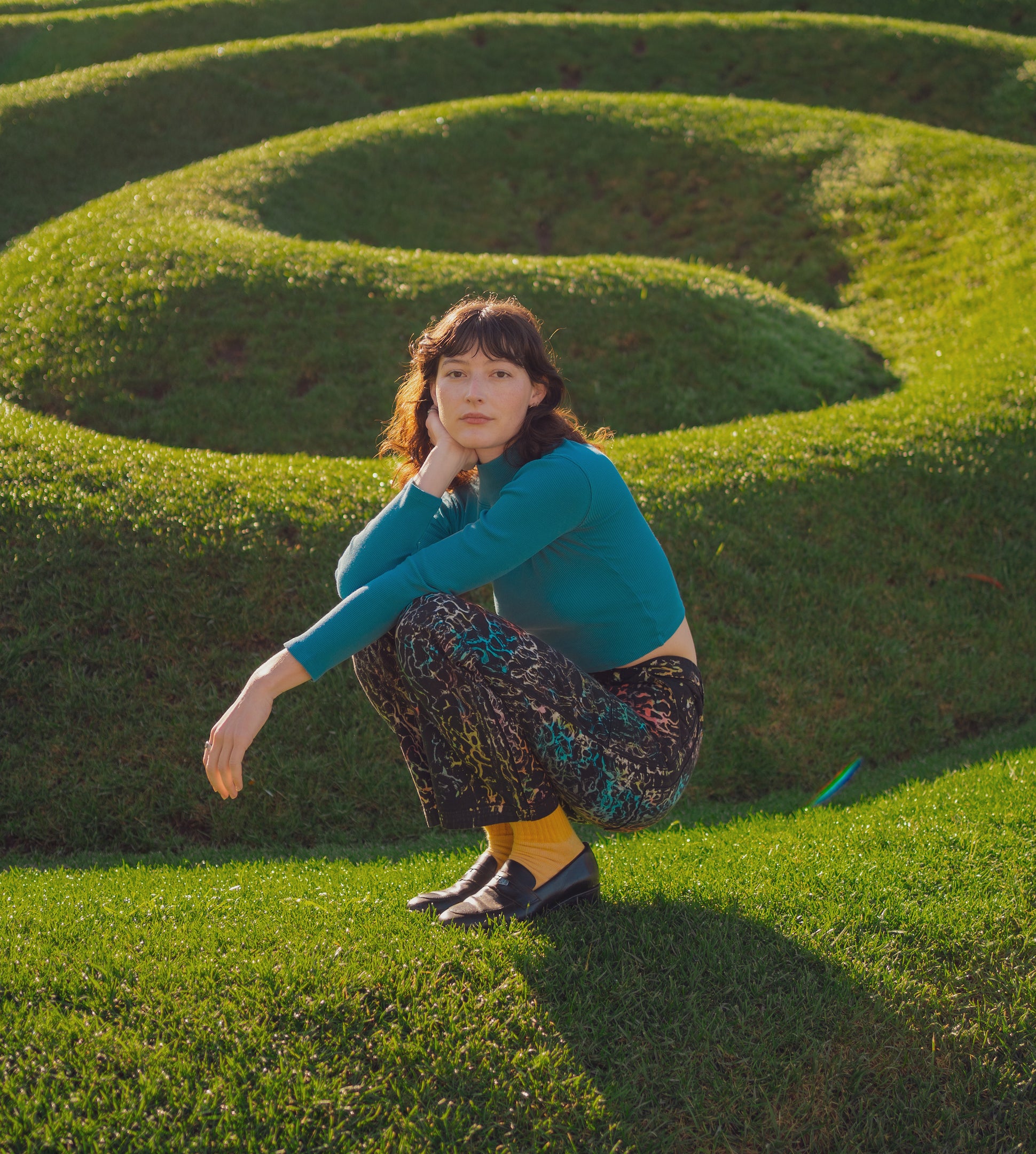 Alex is wearing Work Pants in Wavy Dye and Essential Turtleneck in Marine Blue