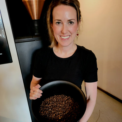 Kate holding freshly roasted coffee