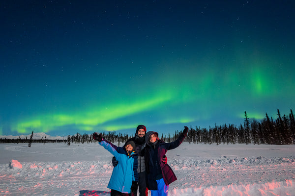 Happy tour guests on an aurora tour in Fairbanks, Alaska