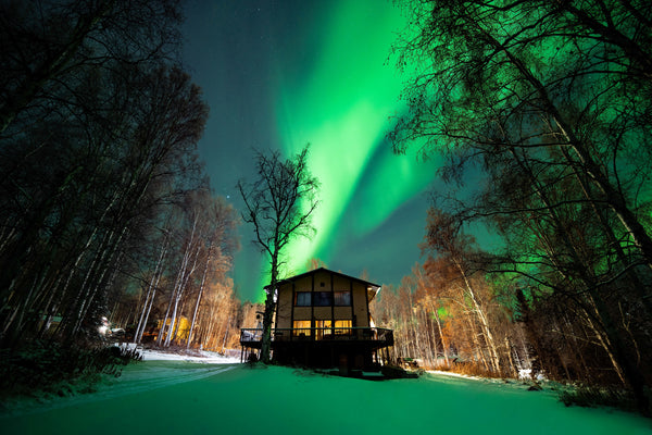 Vincent Ledvina's house in Fairbanks, Alaska under a bright aurora