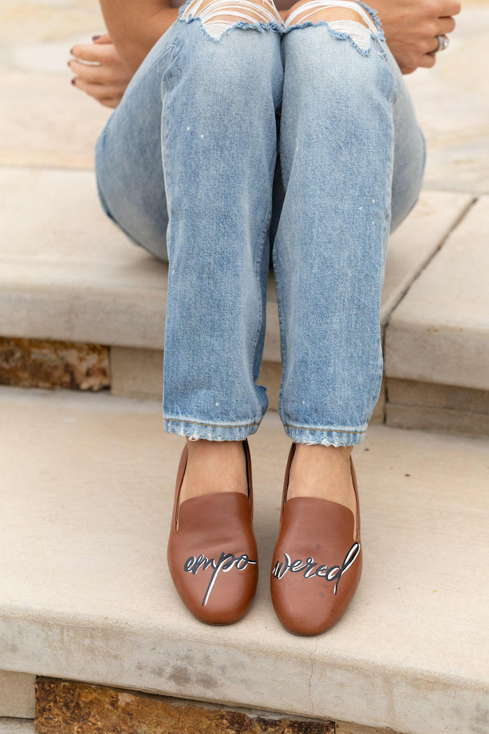 closeup of woman wearing brown hand-painted leather flats