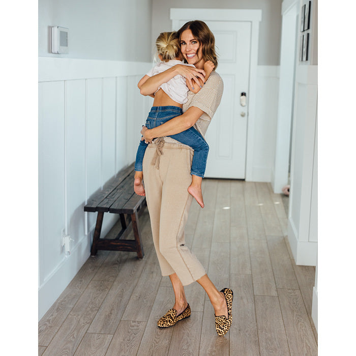 woman in loungewear and cheetah-print flats