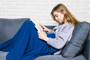 close-up-lying-teen-girl-reading-book-relaxing-home.jpg__PID:d02d8ba4-5254-4df6-a415-4f2a9ff4a983