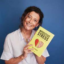 Ana Lombard with her book #POSITIVESTRESS