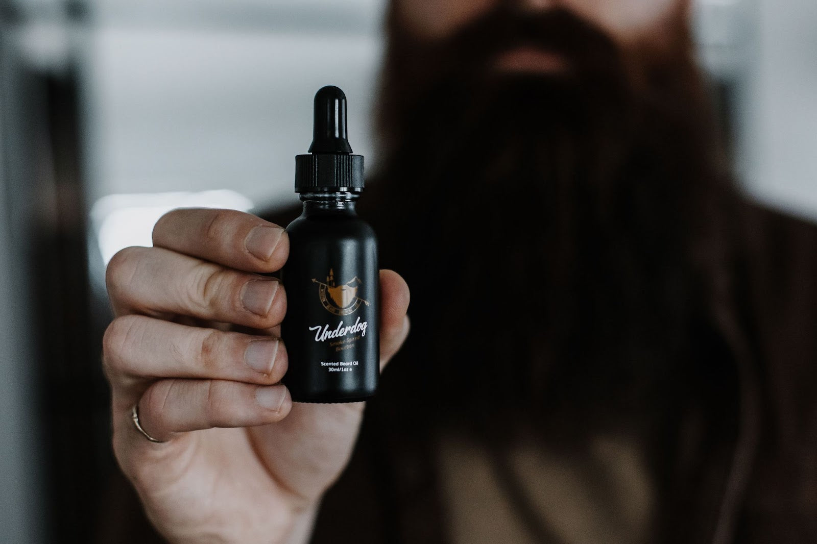 Underdog Beard Oil held by owner Alex Cutler