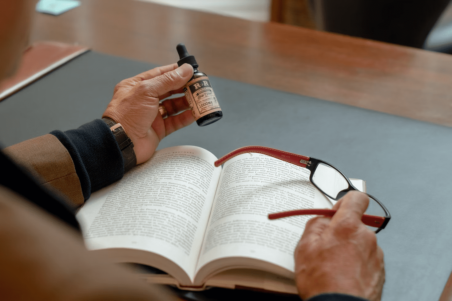 man with beard oil reading book