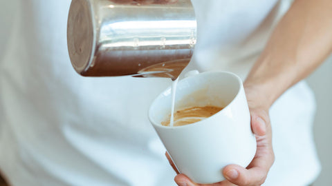 Pour milk into the espresso
