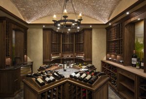 Wine bottles stored at angles in wine cellar