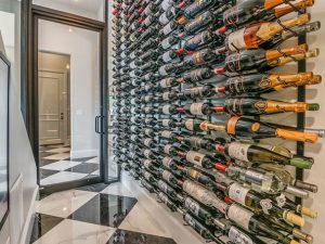 VintageView W Series Metal Wine Rack displaying beautifully arranged bottles of wine.