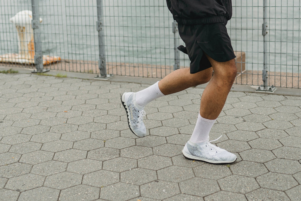 man running in trainers