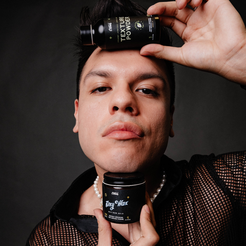 Person holding O'Douds Dry Wax and Texture Powder close above and below their face