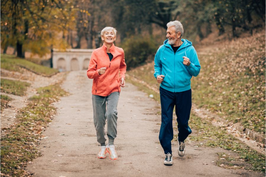 older couple happy running because their vertigo bracelets are working