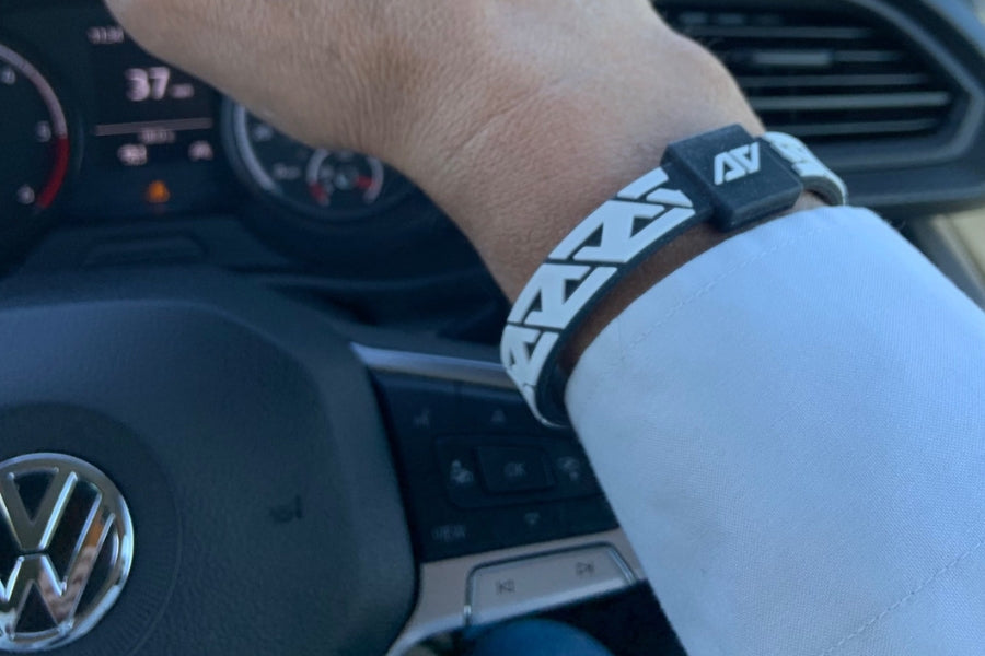 person driving wearing AV wristband