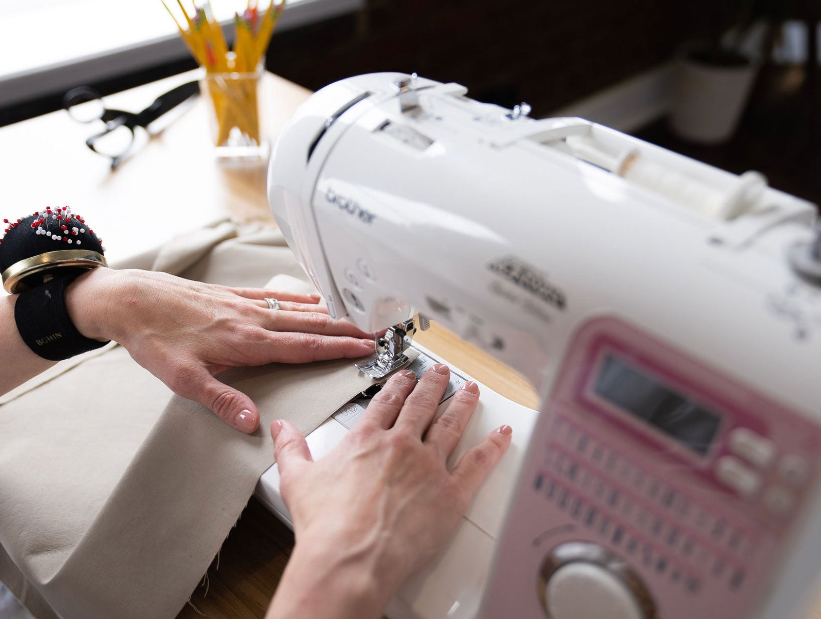 Sewing Instructor Using A Sewing Machine