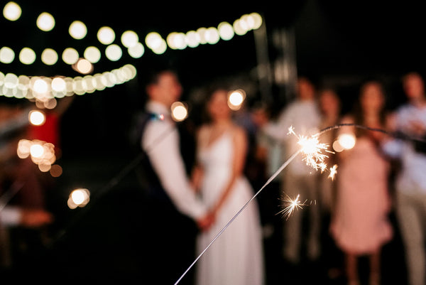 couple as background for a sparkler