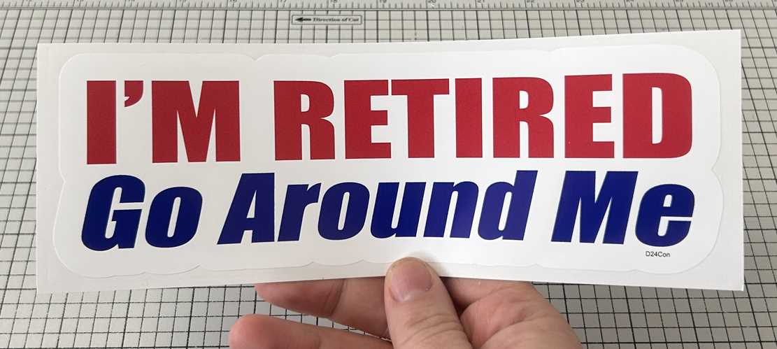 I'M RETIRED. GO AROUND ME - FUNNY CONTOURED BUMPER STICKER IN HAND