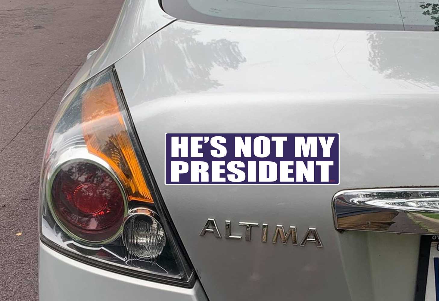 HE'S NOT MY PRESIDENT POLITICAL BUMPER STICKER ON CAR