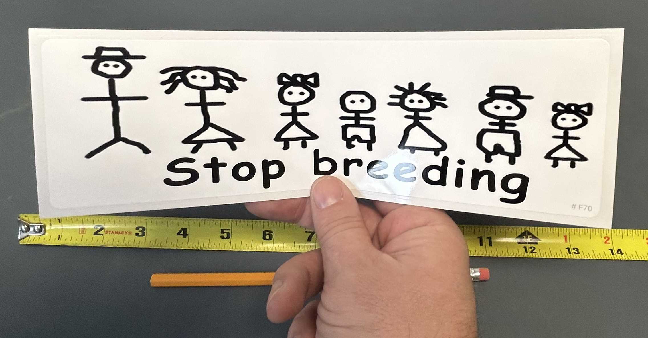 stop breeding bumper sticker in hand