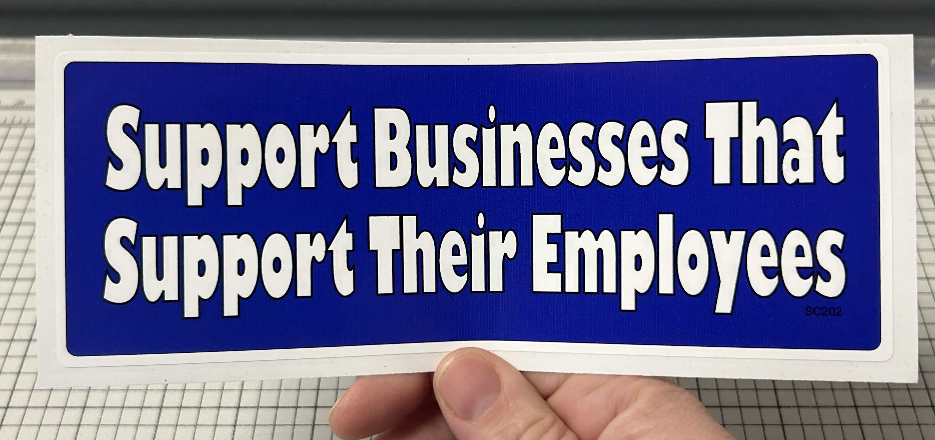 SUPPORT BUSINESSES THAT SUPPORT THEIR EMPLOYEES BUMPER STICKER IN HAND