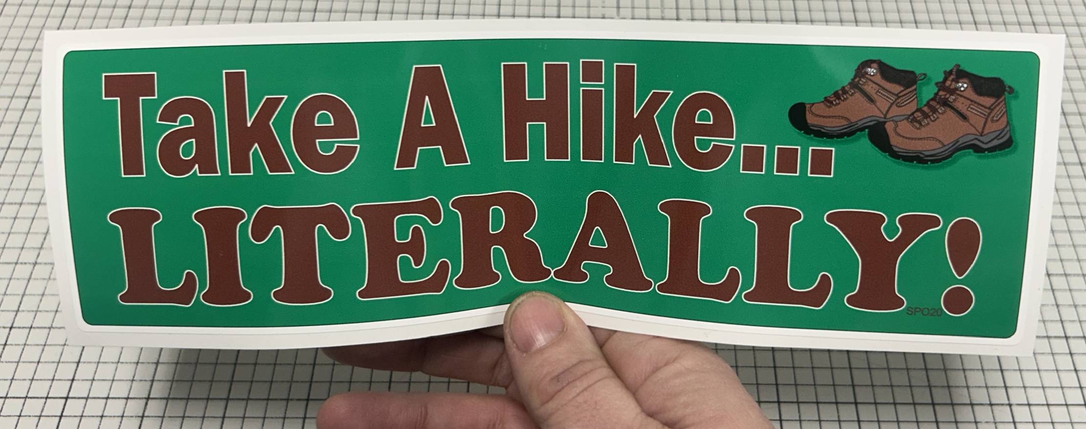 hiking bumper sticker in hand