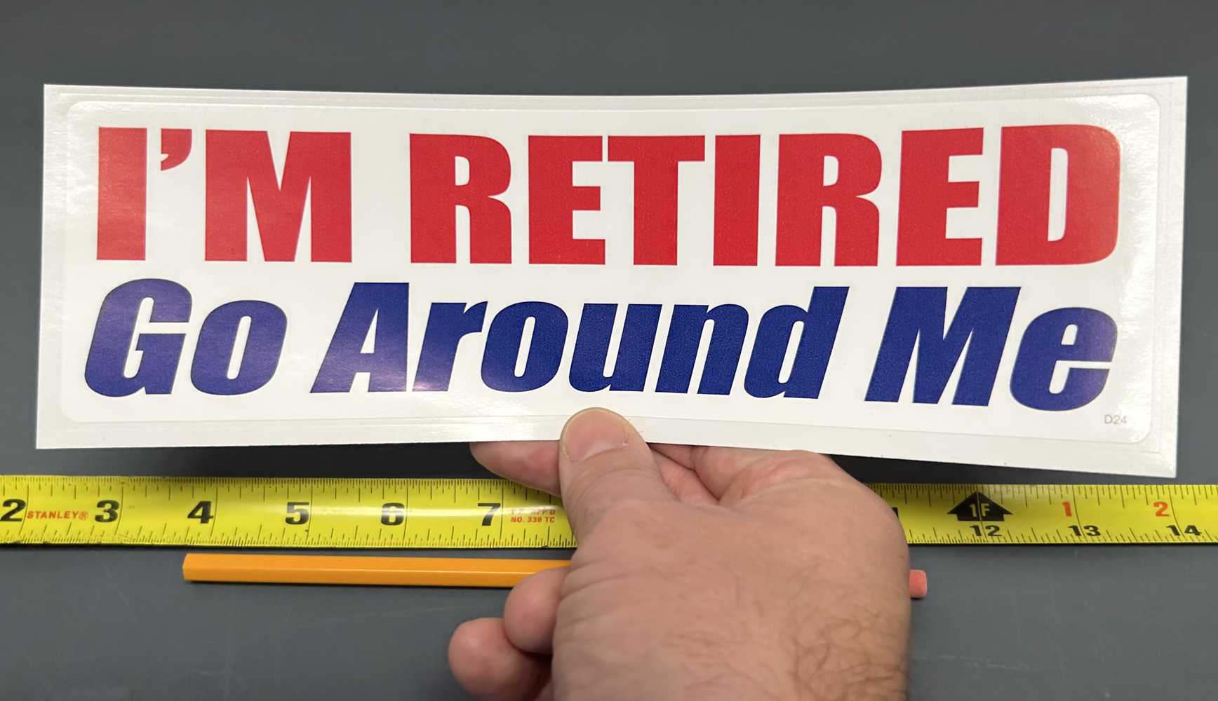 I'M RETIRED. GO AROUND ME BUMPER STICKER IN HAND