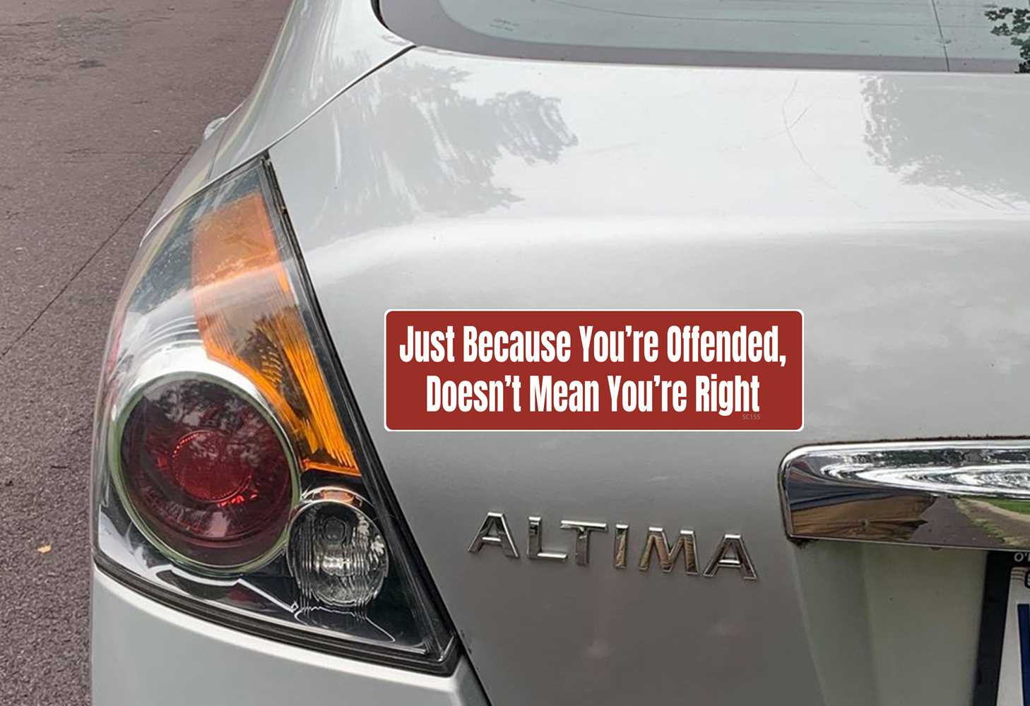 bumper sticker on car