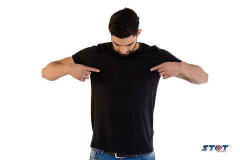 man pointing to his shirt