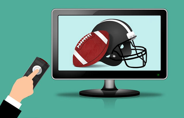 Football and football helmet on television