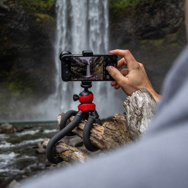 Camera on tripod, filming waterfall