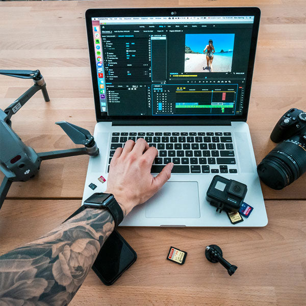 Editor on MacBook editing GoPro footage