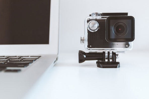 GoPro next to MacBook