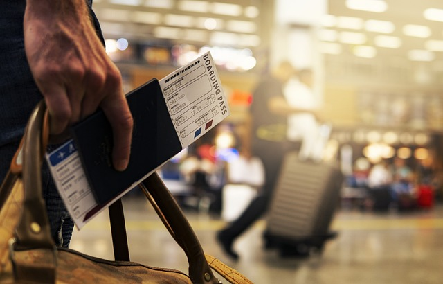 Person travelling with passport in hand