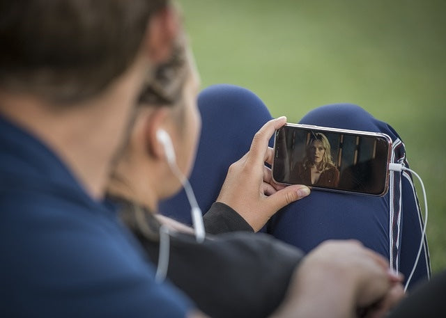 Person watching video on smartphone