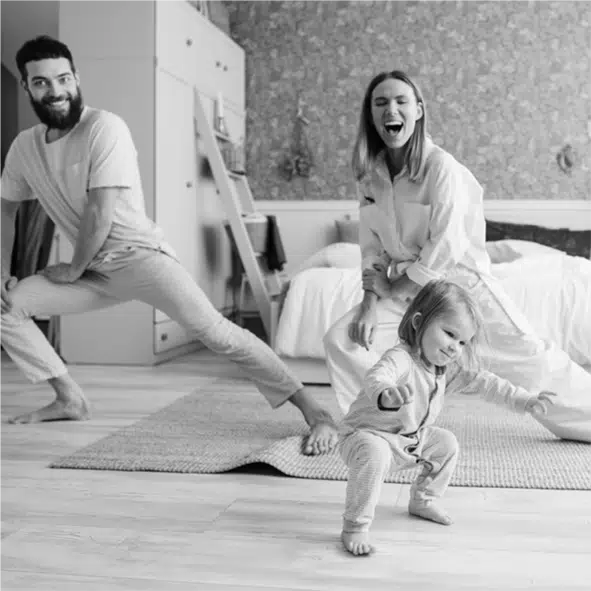 Parents and toddler do yoga in the bedroom. Image: Pavel Danilyuk via Pexels