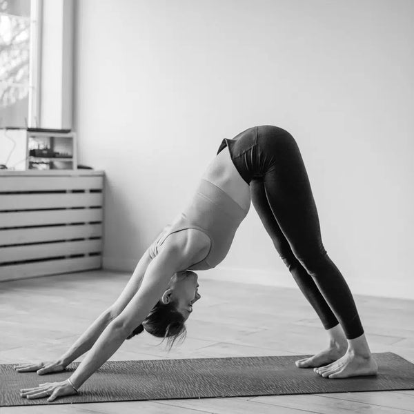 woman doing yoga pose in studio