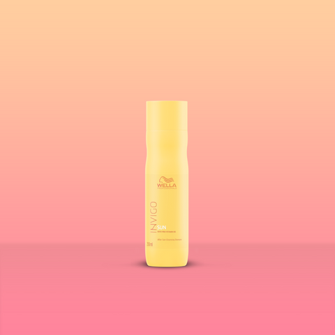 Product image of Wella Professionals Invigio Sun Care Shampoo. Bottle is bright yellow on gradient red and orange background.