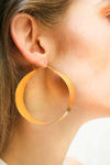 Shining gold-plated hoop earrings, exuding elegance and sophistication