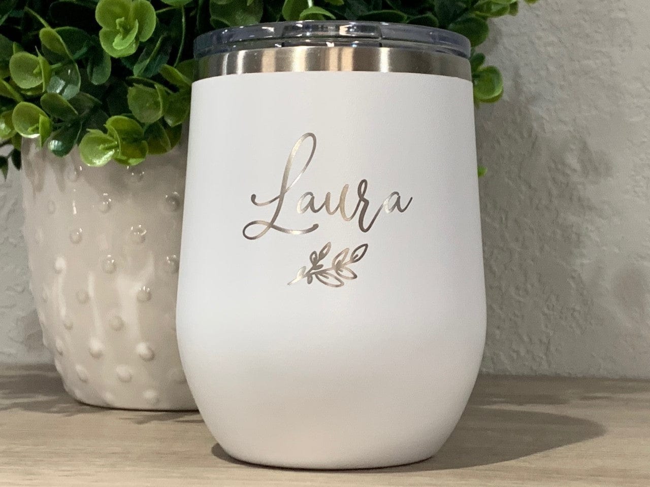 https://cdn.shopify.com/s/files/1/0777/8633/products/12oz-tumbler-wine-tumbler-name-personalized-12oz-wine-tumbler-with-lid-engraved-with-name-and-leaf-34540248694951.jpg?v=1681054208