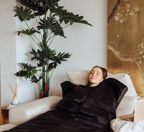 woman lying in sauna blanket